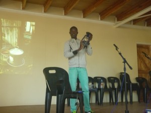 One of the Jacaranda students, Charles, presenting a solar light.