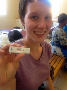 Using a rapid diagnosis test for malaria (mRDT). It was negative-woo, no malaria for me!